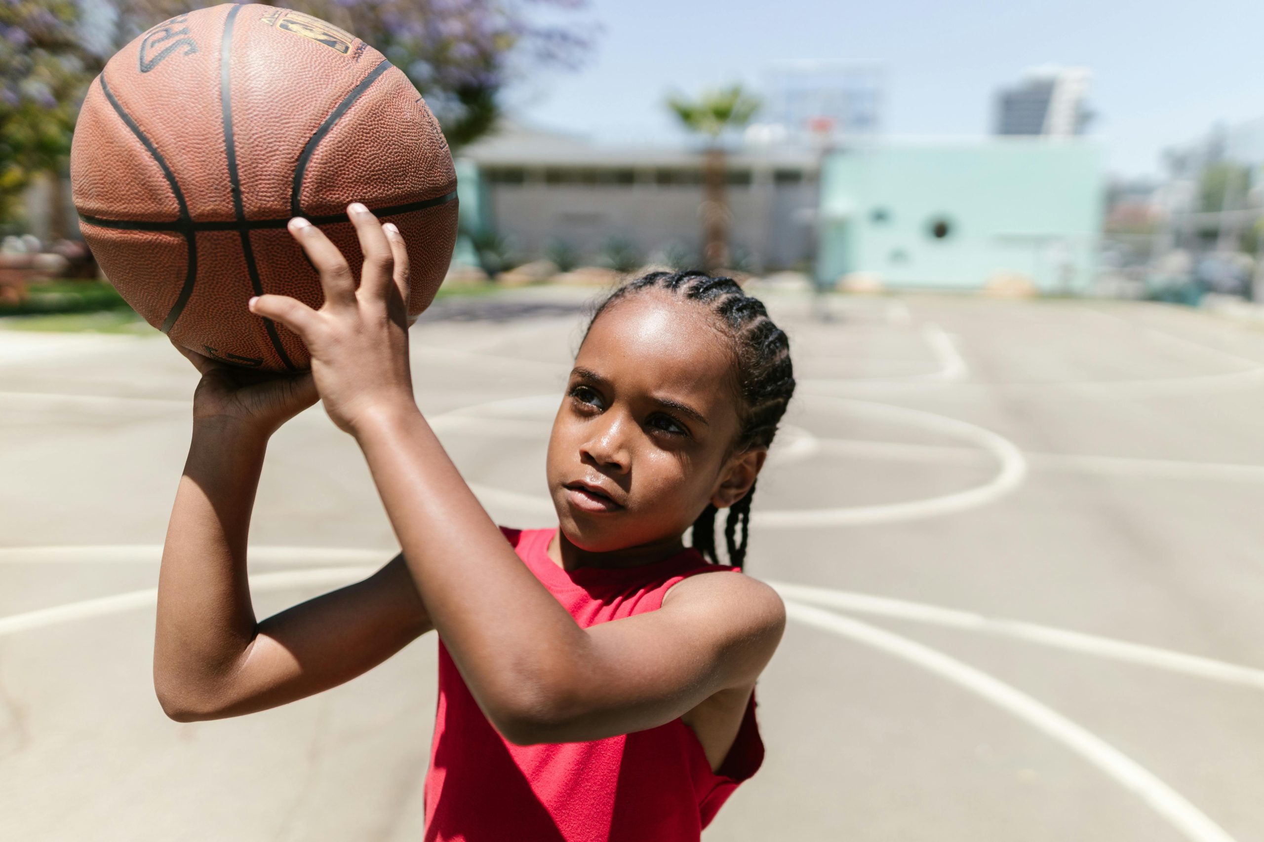 boy shooting a basketball