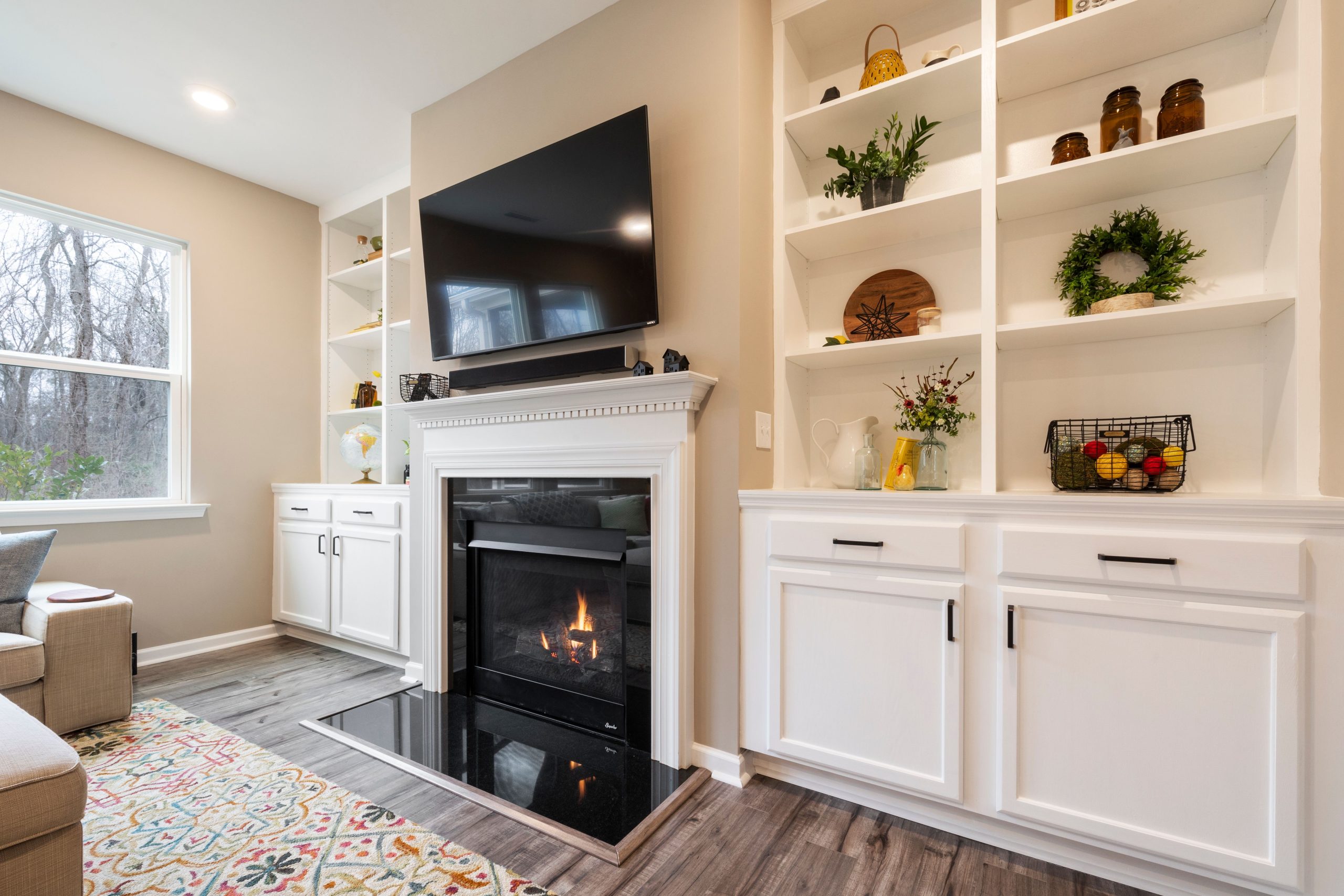living room built-in cabinets displaying home decor