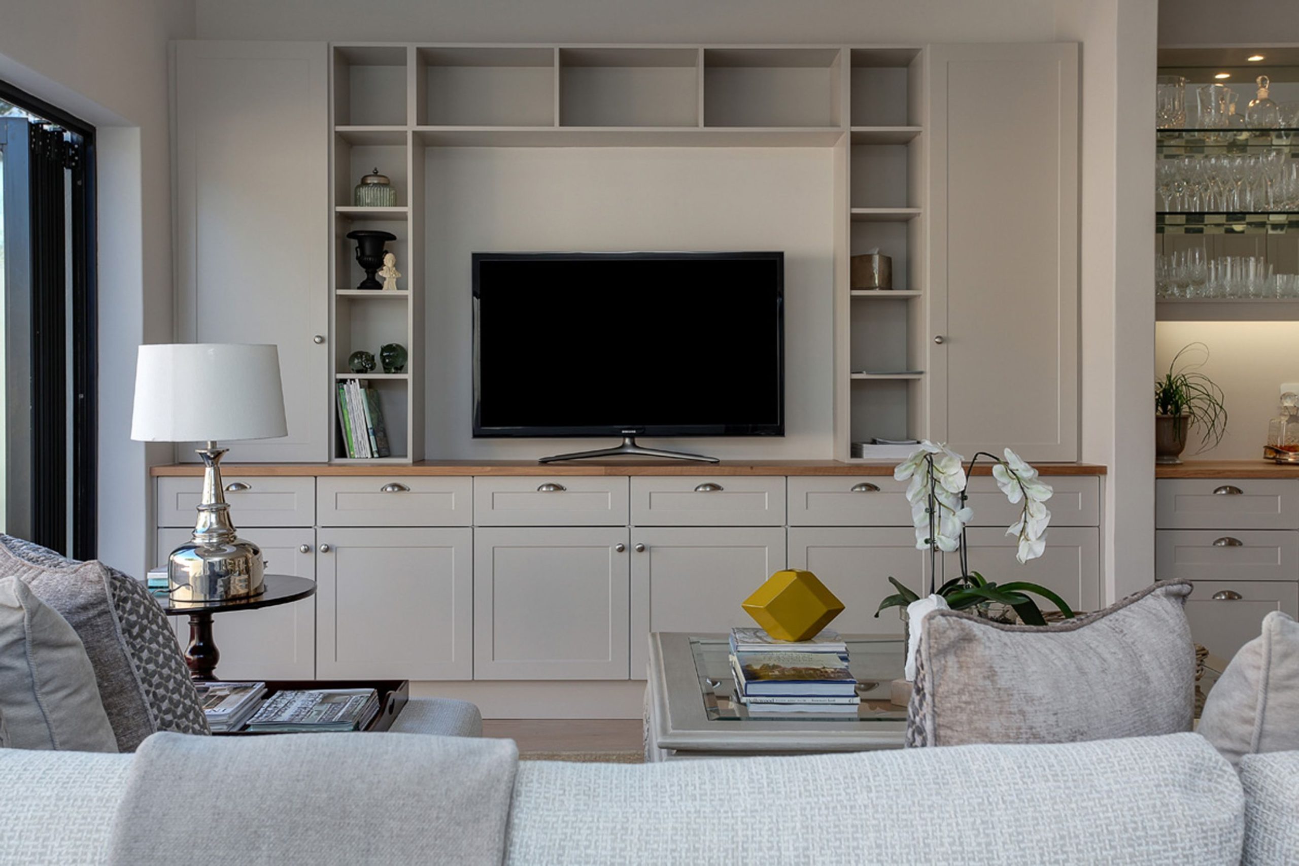 living room featuring a television and built-in cabinets